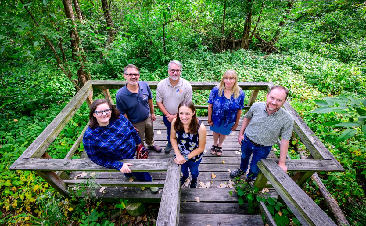 Researchers gather at a wetland area at Busey Woods in Urbana. These wetland areas are disconnected from relatively permanent waters which are not “waters of the United States” and therefore not protected by the Clean Water Act.  From far left, Jessica Monson, Geoffrey Pociask, Paul Marcum, Chelsea Peterson (front center), Julie Nieset and Jeffrey Matthews.