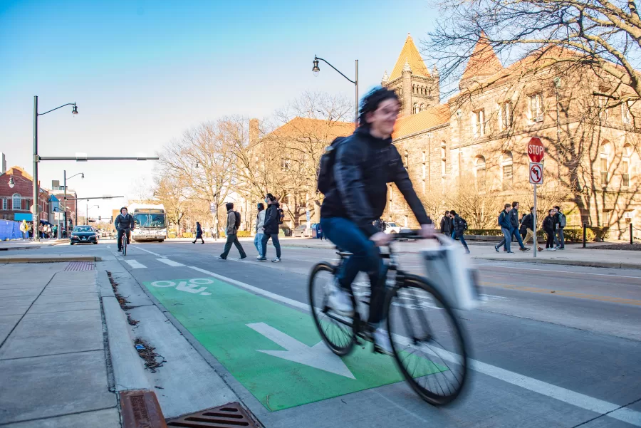 A student races past on a bike on South Wright Street in one of the University’s many bike lanes. Champaign County officials are working to improve bike and pedestrian infrastructure throughout the county.