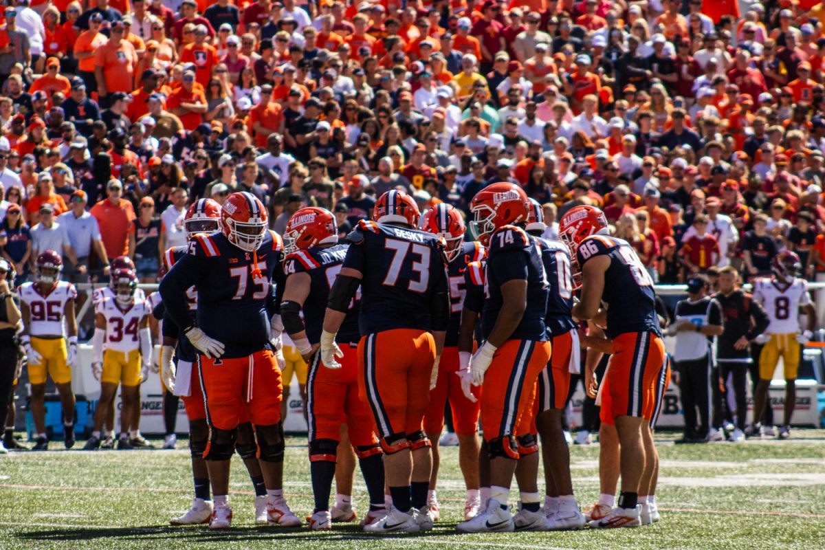 The Illini huddle during the team’s game against the USC Trojans on Sept. 27.