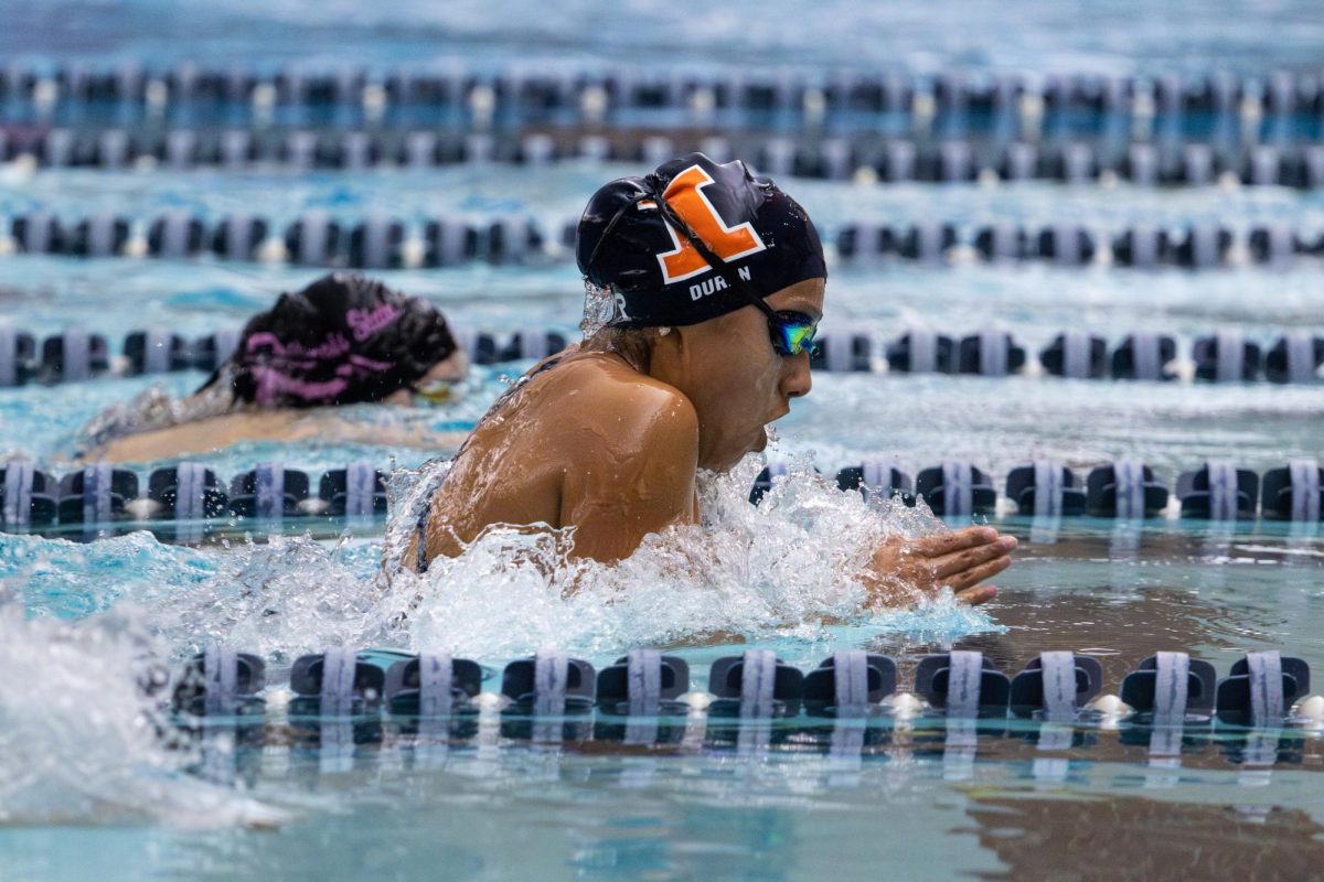 Sophomore Kayla Duran pushes through the water during Illinois' House of Paign Invite on Oct. 24. 