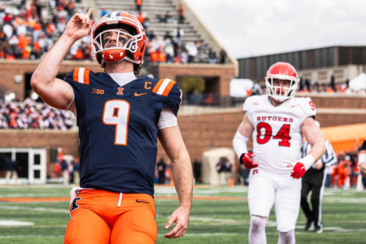 Senior quarterback Luke Altmyer points to the sky in celebration following his rushing touchdown against Rutgers on Nov. 1.