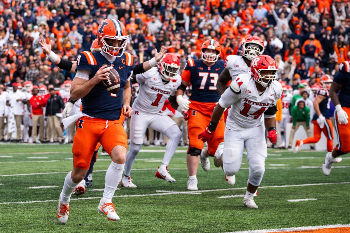 Senior quarterback Luke Altmyer rushes into the endzone against the Rutgers Scarlet Knights on Nov. 1. 