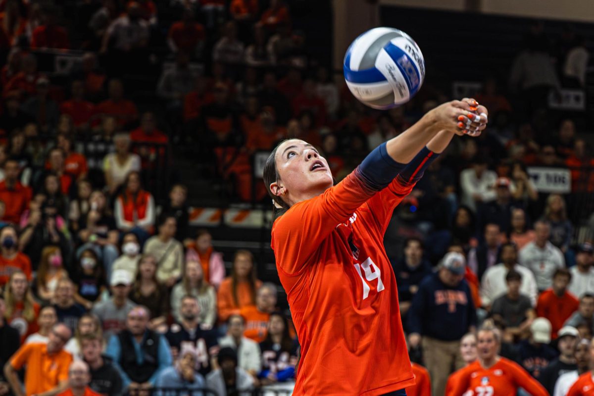 Freshman outside hitter Alyssa Aguayo bumps the ball during Illinois’ match against Iowa on Nov. 2.