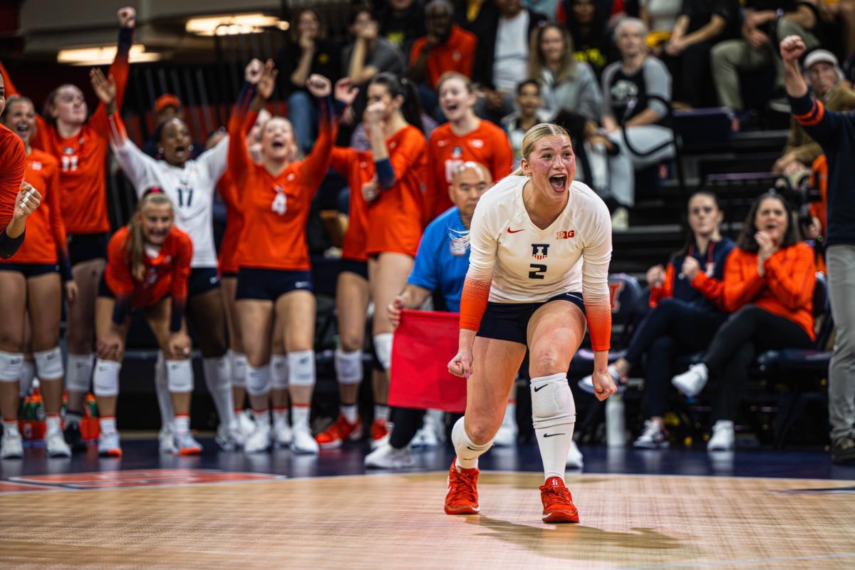 Freshman libero/defensive specialist Taryn Kirsch celebrates during Illinois’ match against Iowa on Nov. 2.  