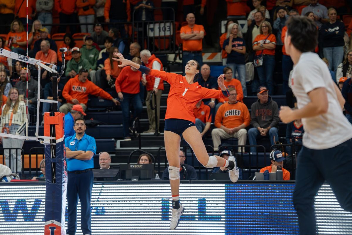 Redshirt sophomore opposite Auburn Tomkinson warms up ahead of the Illinois volleyball game against Iowa in Huff Hall on Nov. 2.