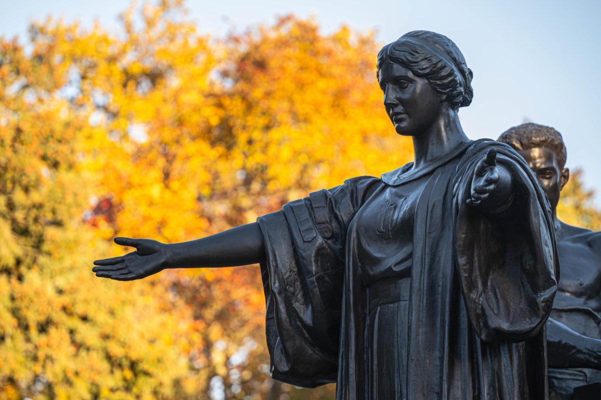 Alma Mater stands with outstretched arms on Nov. 7. 