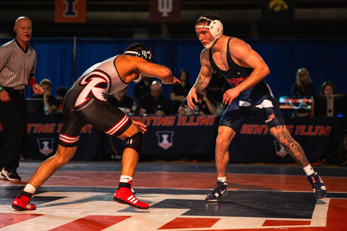 133-pound graduate student Lucas Byrd sizes up his opponent during Illinois’ meet against Rider on Nov. 8.