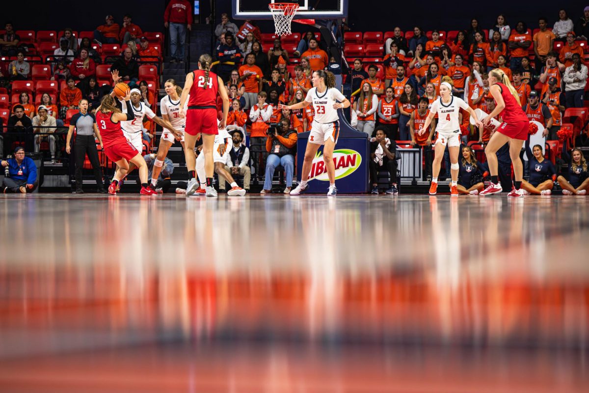 Illinois bands together to make a defensive stop during its game against Illinois State on November 9.