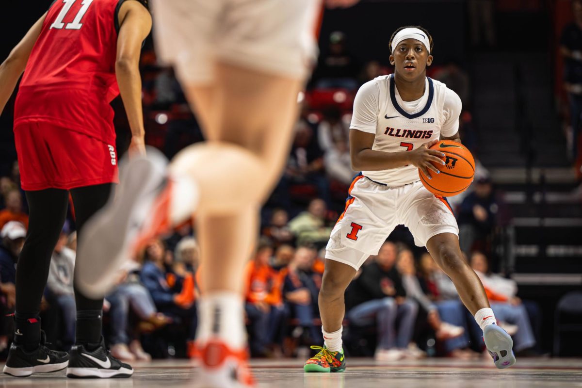 Freshman guard Destiny Jackson eyes down their teammate before passing the basketball during the Illinois vs. Illinois State game on Nov 9.