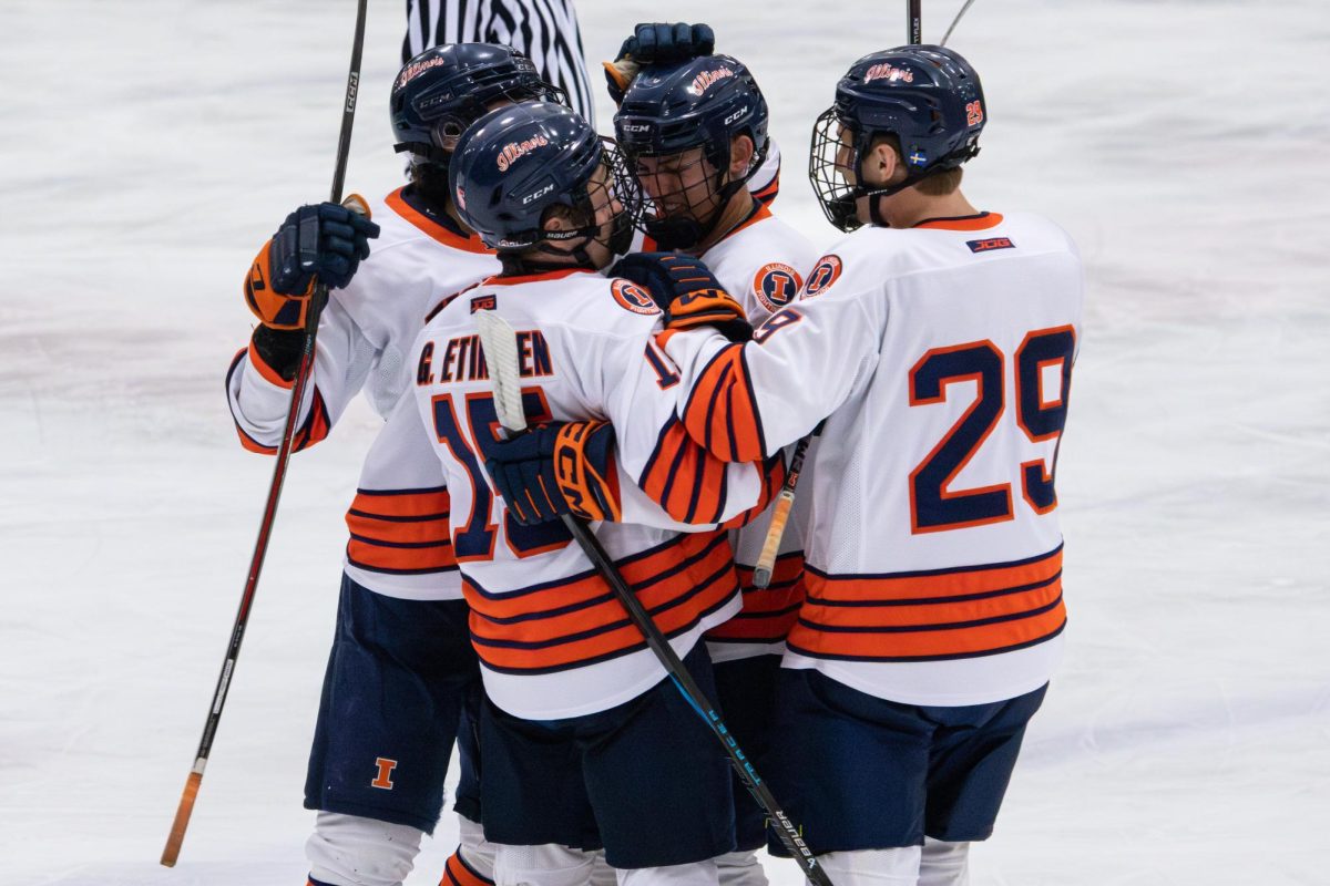 The Illini, including senior forward Gregory Etingen (No. 15) and graduate student forward Ross Jaldung (No. 29) celebrate during the team’s win over the Rutgers Scarlet Knights on Nov. 1. 