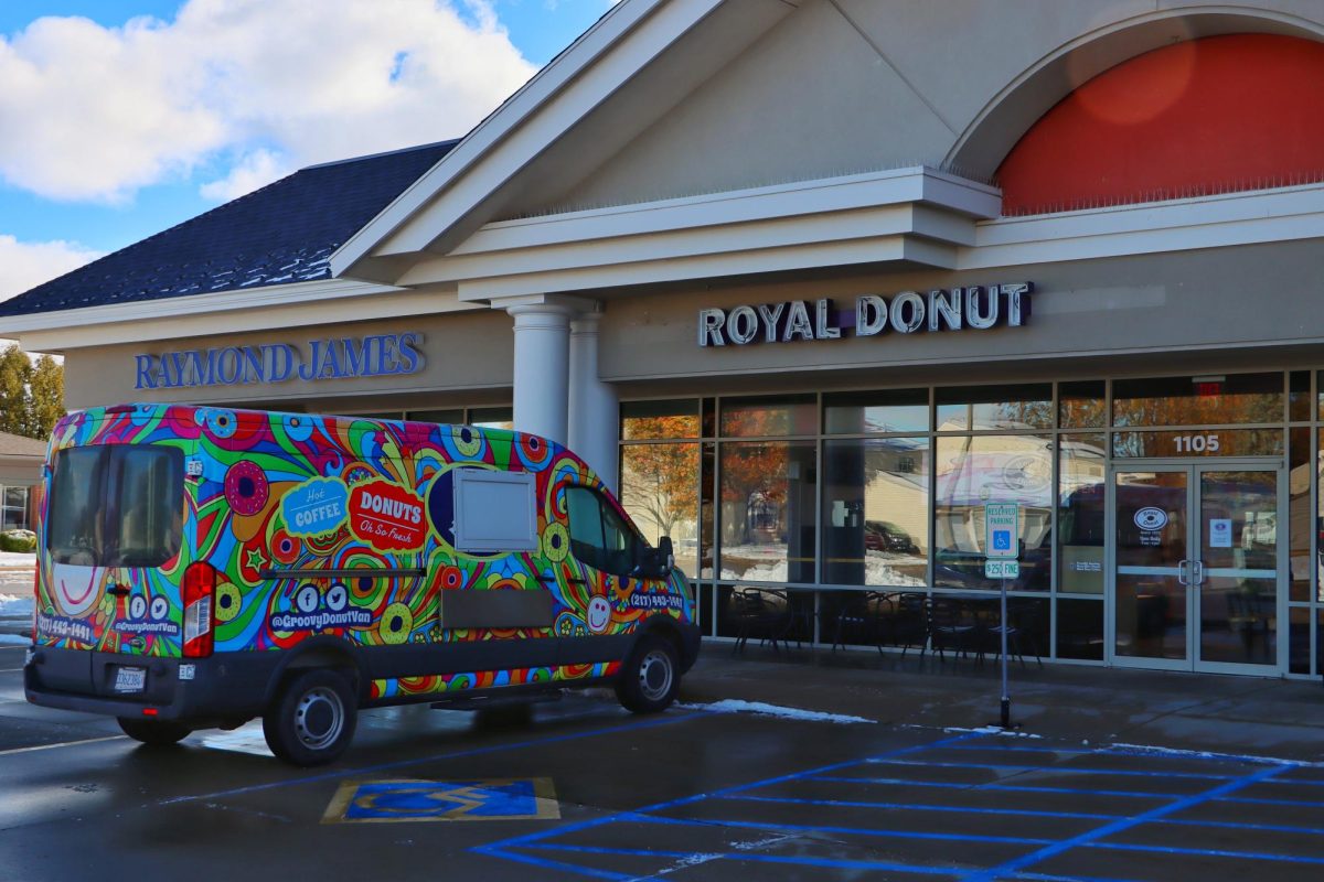 The brand-new Royal Donut and its “Groovy Donut Van” stand ready to welcome customers on Nov. 10. Located at 1105 W. Windsor Rd, Royal Donut officially opened its doors at 6 A.M. on Nov. 11.