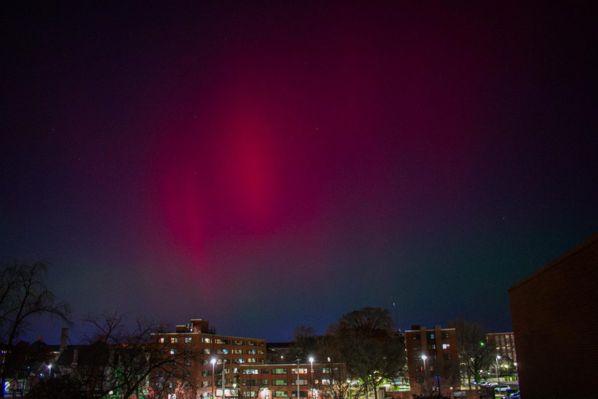 The sky is filled with reds, purples, blues and greens during the largest solar flare of the year, leaving the aurora borealis visible over campus on Tuesday night. 