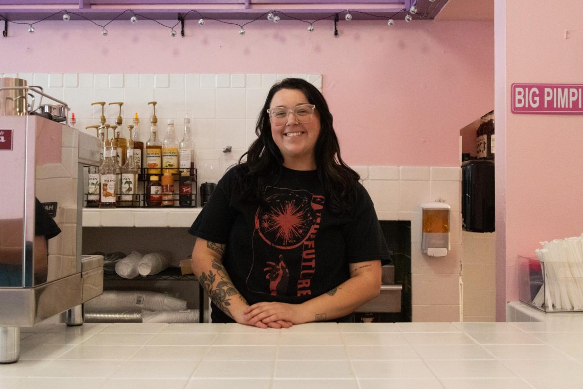Caffeine RX owner Bailey Roth stands at the counter of the newly opened cafe in Downtown Champaign on Nov. 12. The cafe opened on Nov. 1 and serves specialty drinks alongside baked goods.