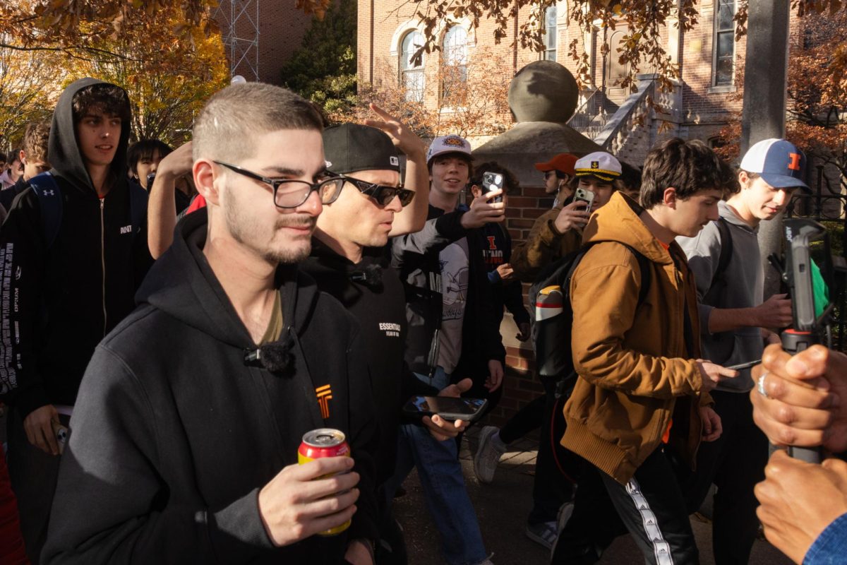 Joshua Block, a popular social media personality, walks with a Twisted Tea among a crowd during his visit to the University Wednesday.