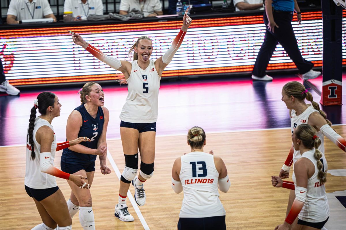 The Illini celebrate during their match against the Washington Huskies on Nov. 14. 