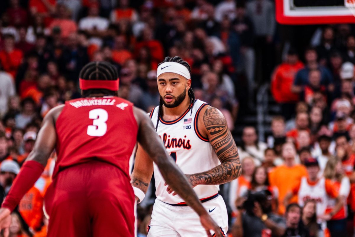 Senior guard Kylan Boswell dribbles the ball at the top of the key against Alabama on Nov. 19.