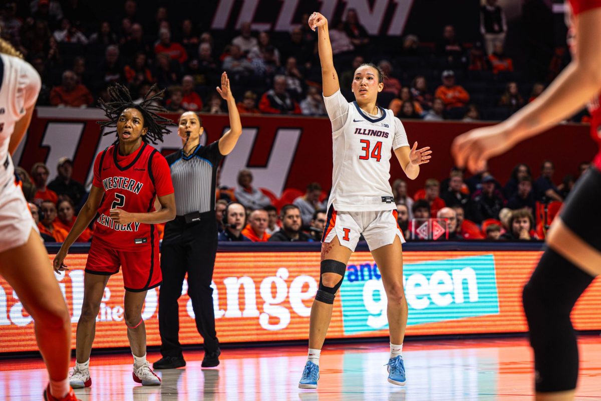 Junior guard Maddie Webber follows through a shot during Illinois game against Western Kentucky on Nov. 26. 