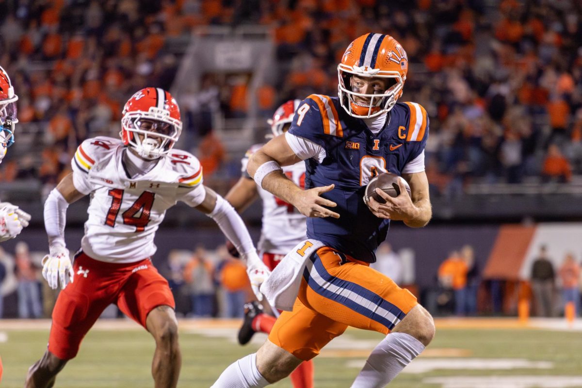 Senior quarterback Luke Altmyer runs with the ball during Illinois’ win over Maryland on Nov. 15. 