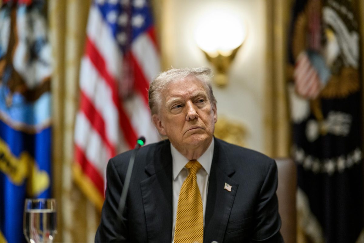 President Donald Trump sits in the Cabinet Room of the White House on Nov. 7. The University Senate approved a resolution Monday urging administrators to continue rejecting Trump’s higher education compact.