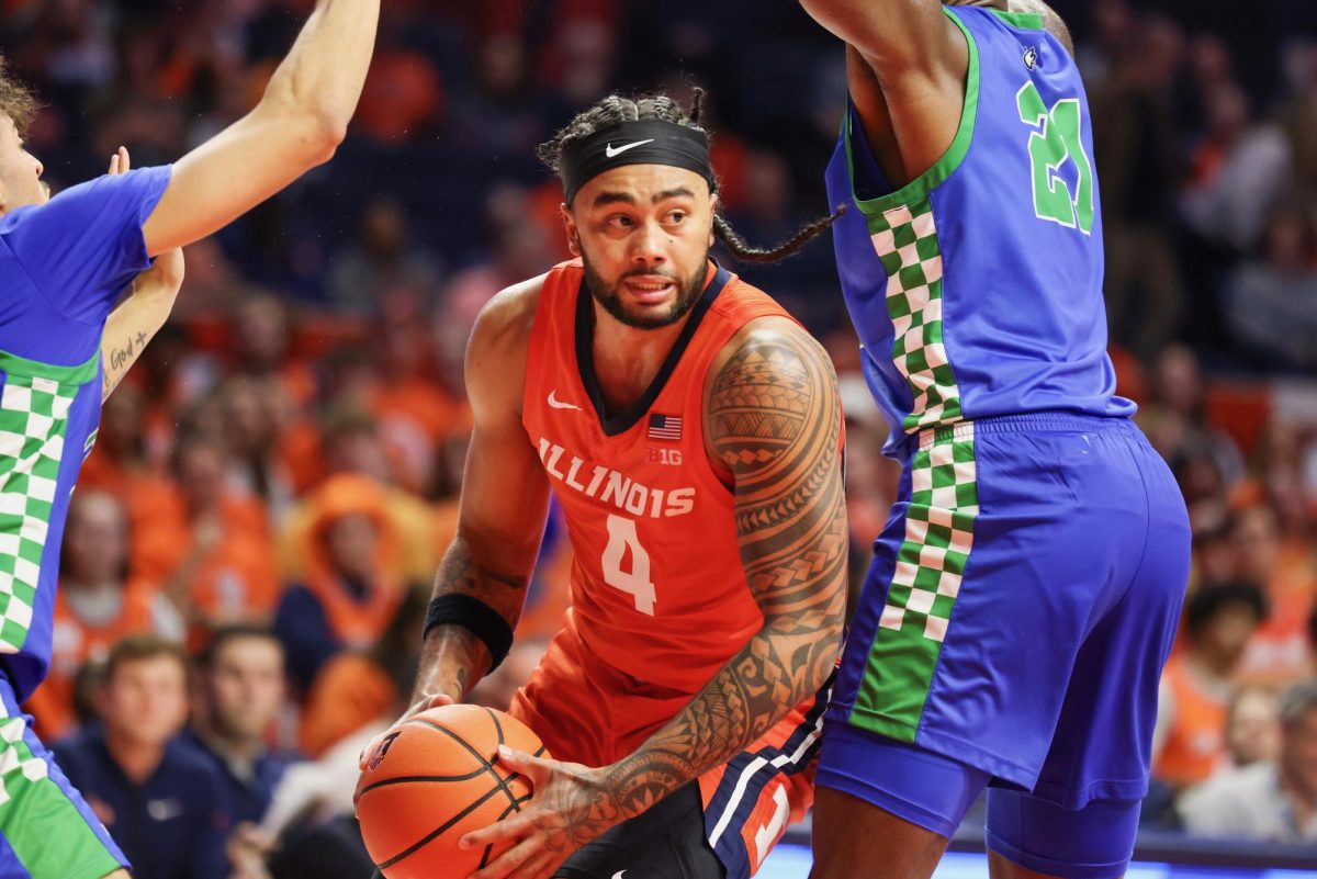 Senior guard Kylan Boswell drives into the lane against Florida Gulf Coast on Nov. 7 at State Farm Center.