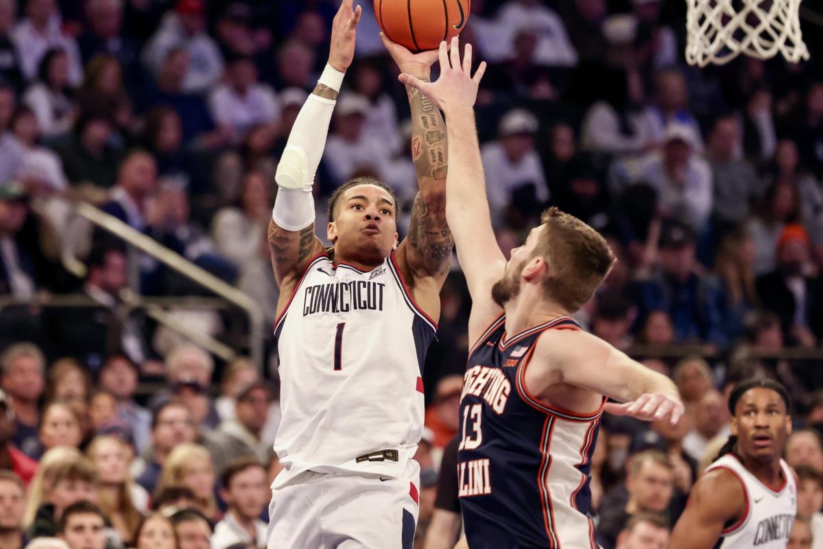 UConn junior guard Solo Ball shoots over Illinois junior center Tomislav Ivišić at Madison Square Garden on Nov. 28.