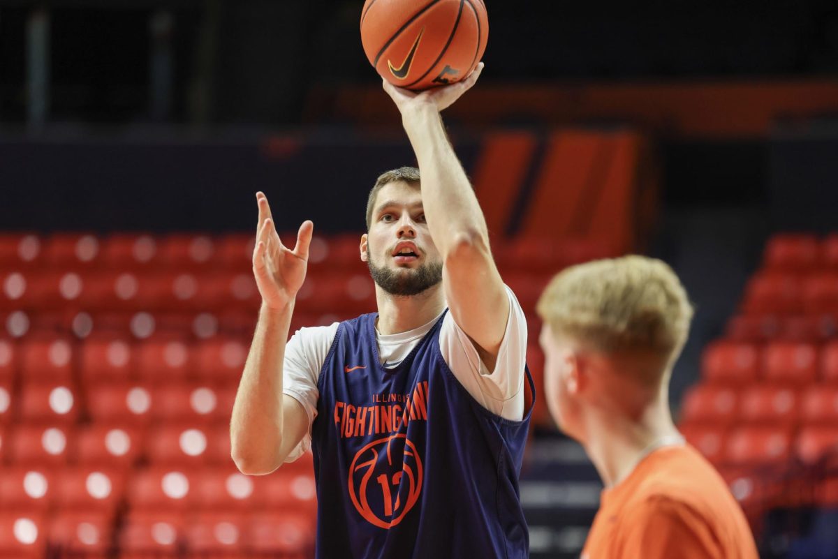 Junior center Tomislav Ivišić shoots a floater ahead of practice on Nov. 2 at State Farm Center.