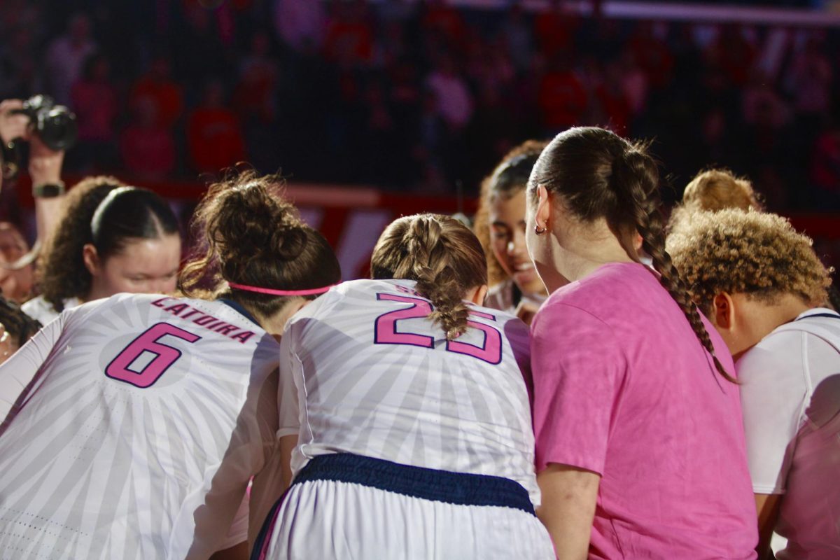 The Illini huddle up on the court during their game against the Nebraska Cornhuskers on Feb. 16. 