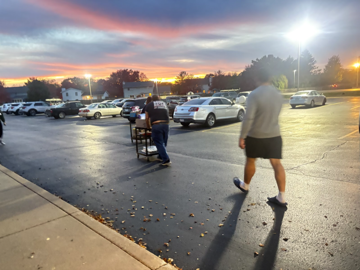 Patrons exit the Windsor Road Christian Church’s Free Food Store on Nov. 6. The food pantry has seen unprecedented demand since SNAP benefits briefly lapsed.