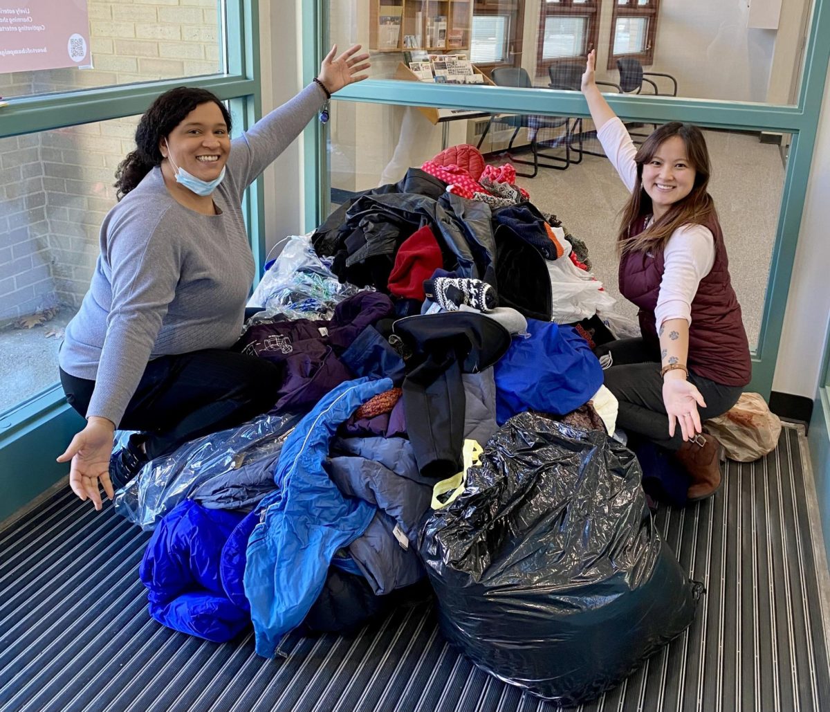 Members of Champaign’s equity and engagement department counting donated winter clothing items in 2022.