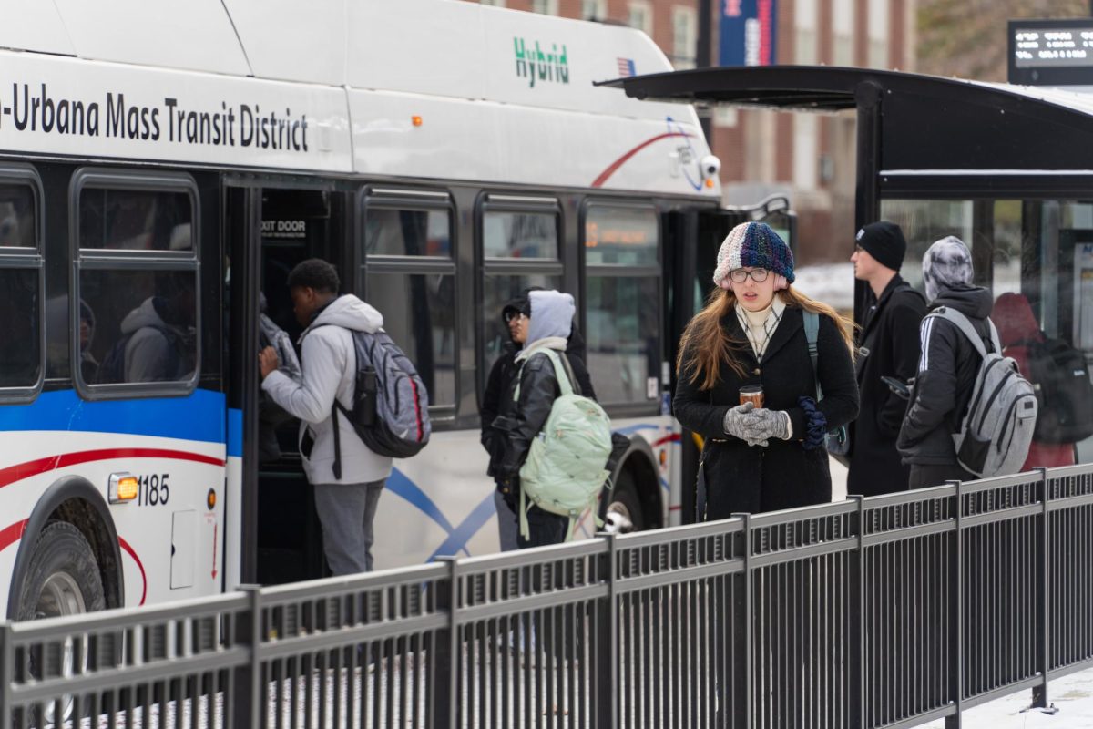 People queue to get on a bus at the corner of Wright & Healey Streets on Jan. 17, 2024. Several reroutes for MTD buses on campus issued during fall break were extended due to weather. 