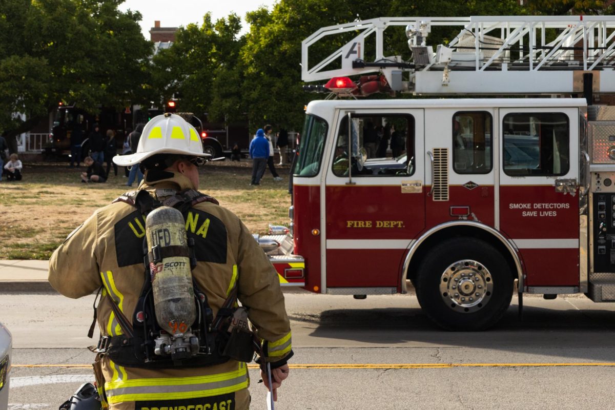 An Urbana firefighter crosses Lincoln Avenue while responding to a fire inside Lincoln Avenue Residence on Oct. 24. Urbana’s city council and mayor have appointed an Interim Fire Chief, Tal Prendergast, to serve until June.