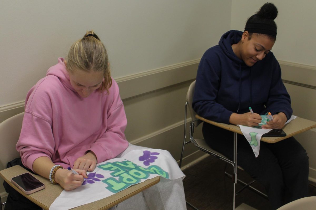 Charlotte Sampson (left), a senior in LAS at the University, and Alexandria Jackson (right), a senior in AHS, work on their pet bandanas at the Volunteer Illini Project’s Bandanas Furr-ever Friends event at the English Building in Champaign Nov. 19. Participants decorated bandanas that would go to the local animal shelters for animals looking for a permanent home.