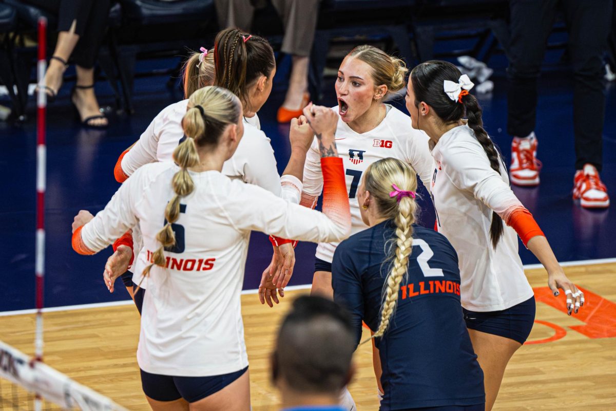 Illinois celebrates a point during its match against Northwestern on Nov. 28.