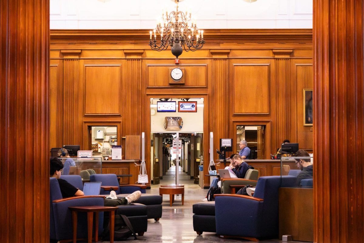 Students study outside of the Main Stacks area of the University Library on Dec. 15. The Main Stacks are located on the second floor of the Main Library.