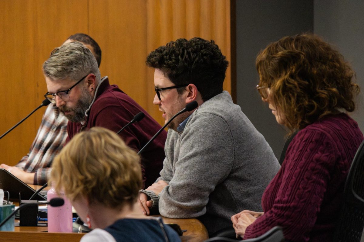 Champaign City Council members ask City Attorney Thomas Yu questions about a proposed ordinance to ban camping on city property at Tuesday night’s meeting. The council ultimately voted unanimously against it.