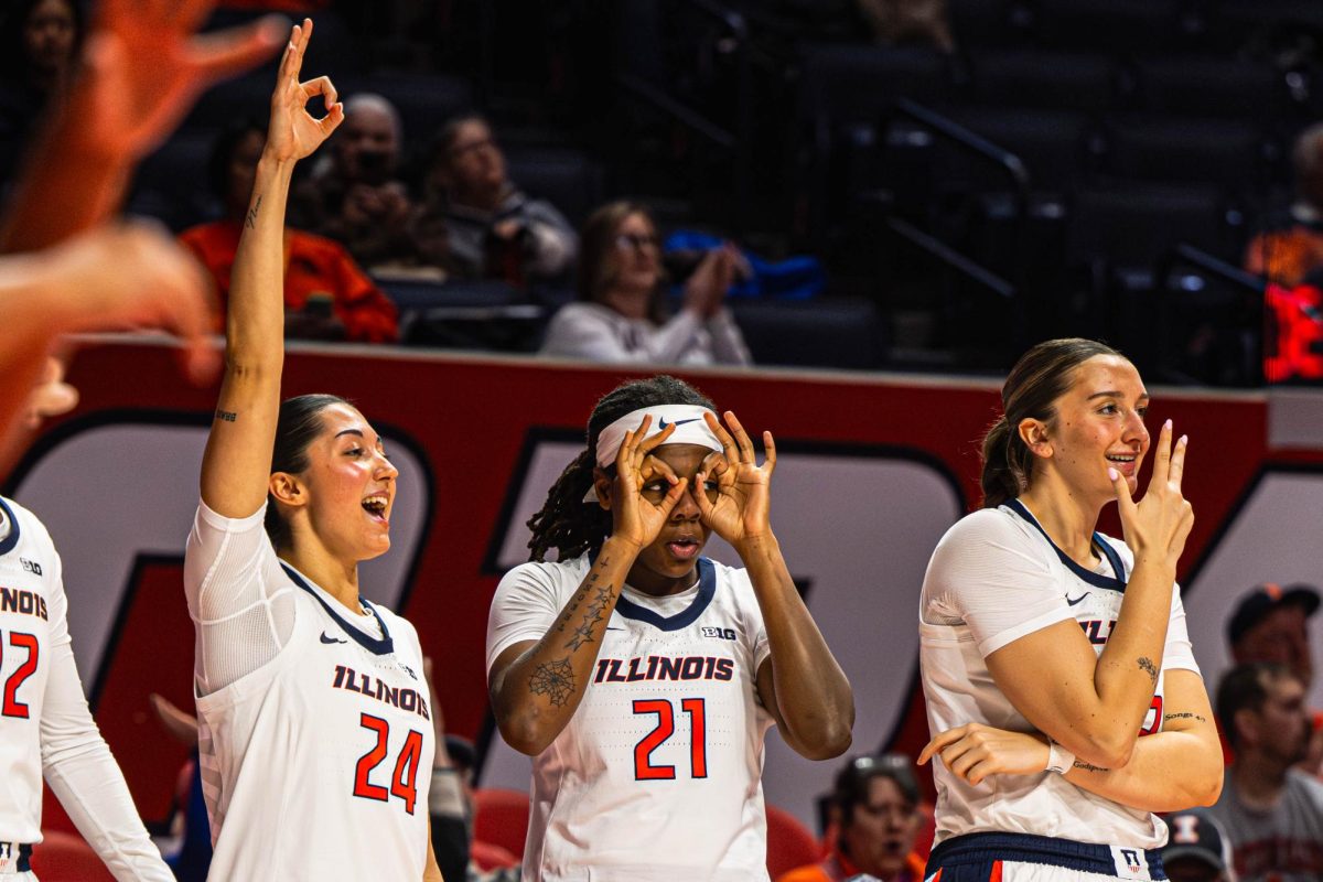 The Illinois bench celebrates a three point basket during the Illinois v. Bellarmine game on December 2. Illinois would go on to win the game 90-41.