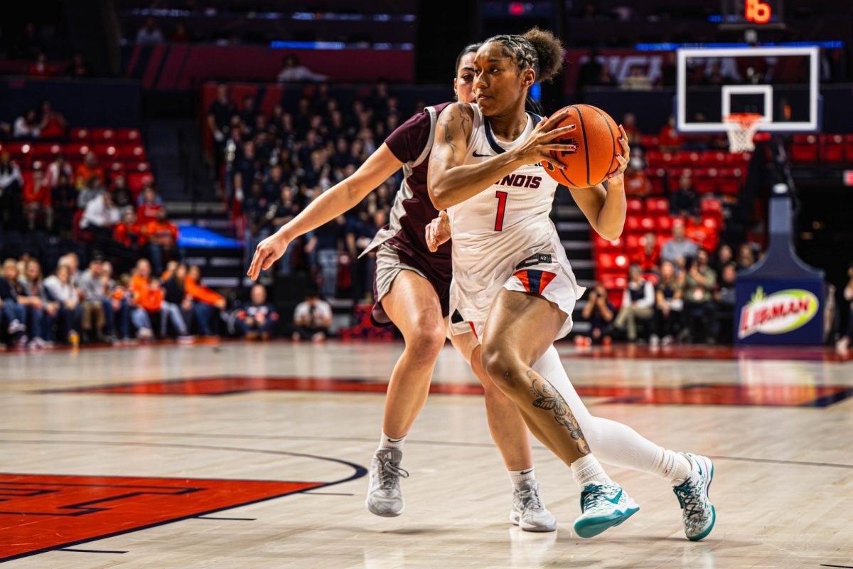 Sophomore guard Aaliyah Guyton drives past the defender during Illinois' game against Bellarmine on Dec. 2.