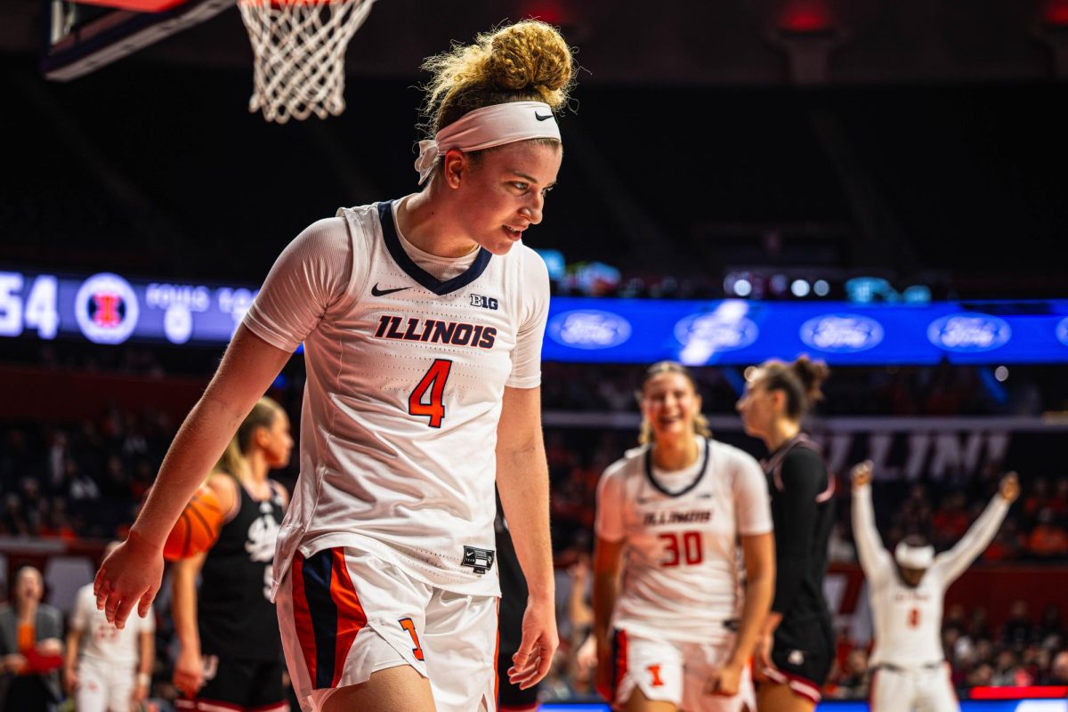 Junior guard Gretchen Dolan walks away from the basket following a layup and a foul during the Illinois vs. Indiana game on Dec. 6. Illinois would go on to win the game 78-57.