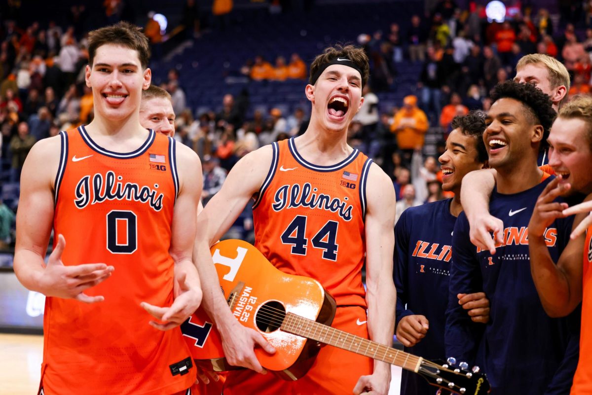 Freshman forward David Mirković (left) and junior center Zvonimir Ivišić (right) celebrate following Illinois' win over Tennessee at Bridgestone Arena on Dec. 6.