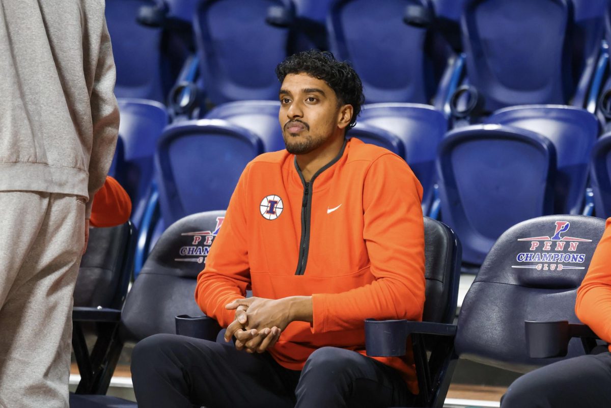 Neel Ganta sits courtside at The Palestra in Philadelphia ahead of Illinois men's basketball's game against Penn State on Jan. 3.