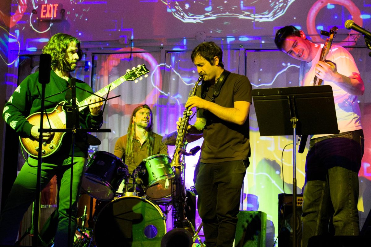 Guitarist Mark White, drummer Michael Linder, saxophonist Louie Pappas and bassist Nate Hahn perform at Gallery Art Bar in Urbana on Jan. 24. Throughout the evening, they performed a variety jazz standards that were decided on the spot.