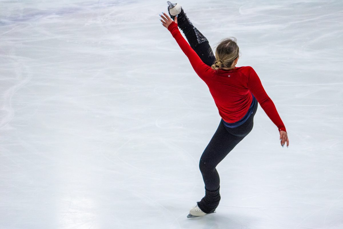 Camille Hutchinson, freshman in AHS, practices a figure skating routine at the Ice Arena on Feb. 3. The Illinois Intercollegiate Figure Skating team practices at the facility three times per week.