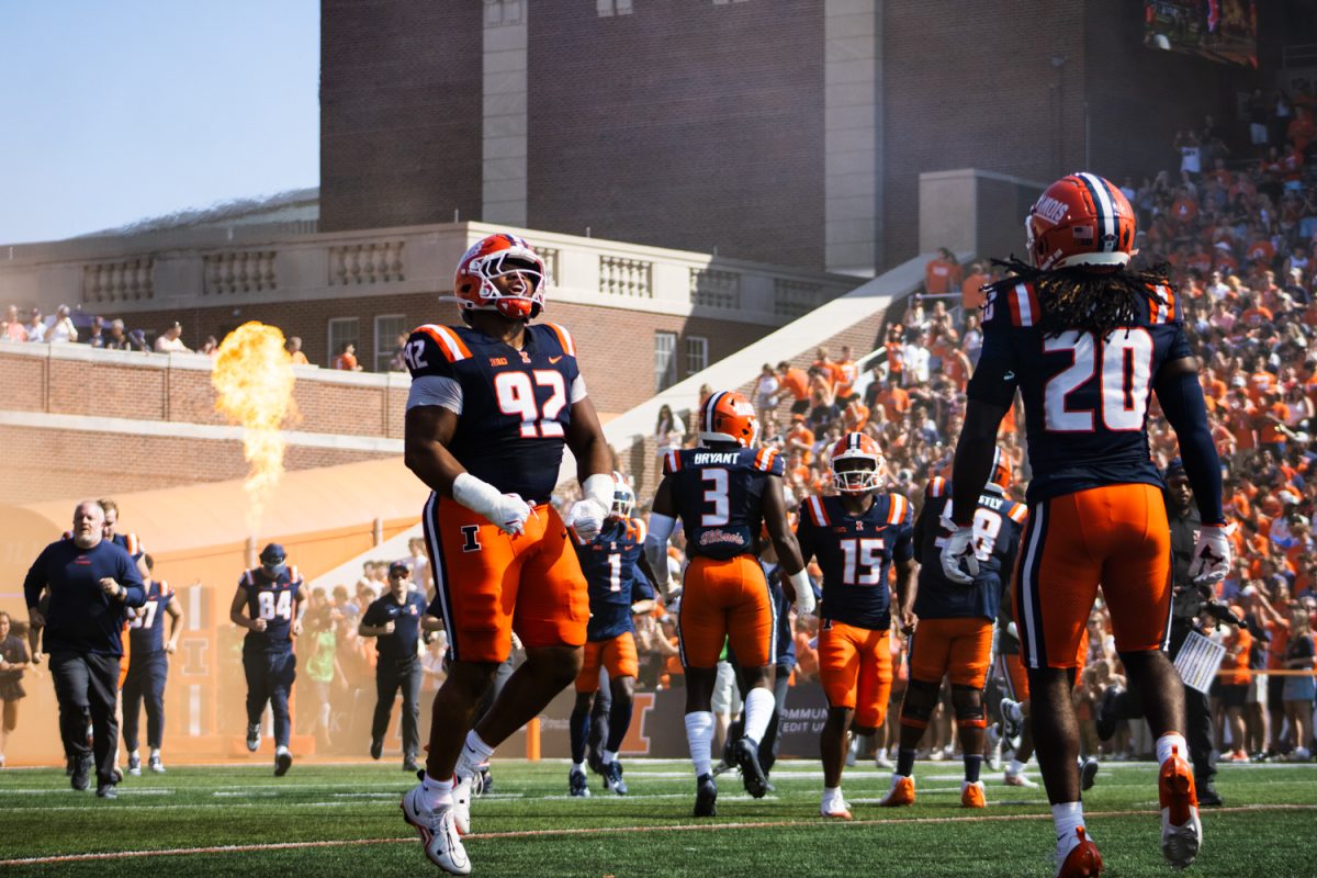 The Illini run onto the field ahead of the team's game against the Southern California Trojans on Sept. 27, 2025.