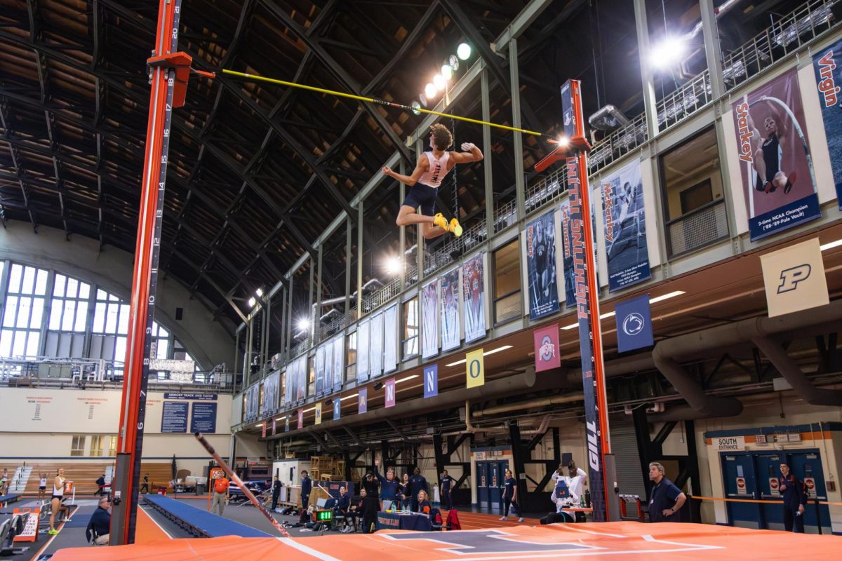 Illinois junior pole vaulter Cody Johnston clears the 5.63 meter mark at the Illini open in the Armory on Saturday, Jan. 10.