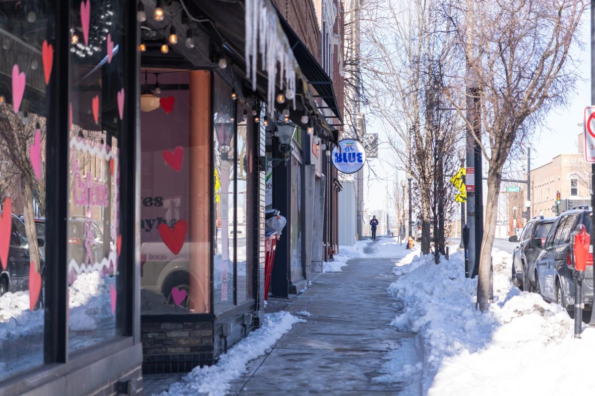 Restaurant signs line a street in downtown Champaign on Wednesday. The annual event features participating restaurants offering special menus and deals throughout Champaign-Urbana and some surrounding towns.