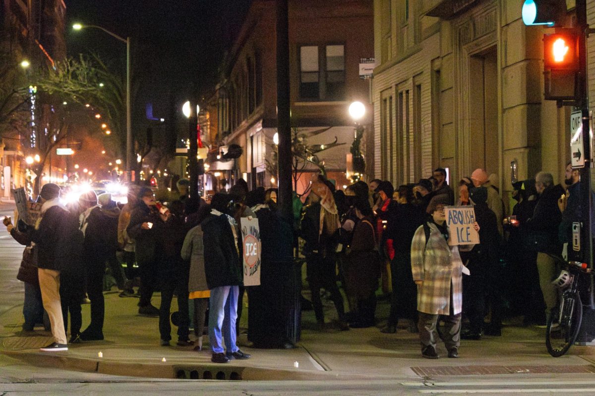 Community members gather outside of the Champaign City Building Wednesday to hold a vigil for Renee Nicole Macklin Good, who an Immigration and Customs Enforcement officer shot and killed in Minneapolis earlier Wednesday.
