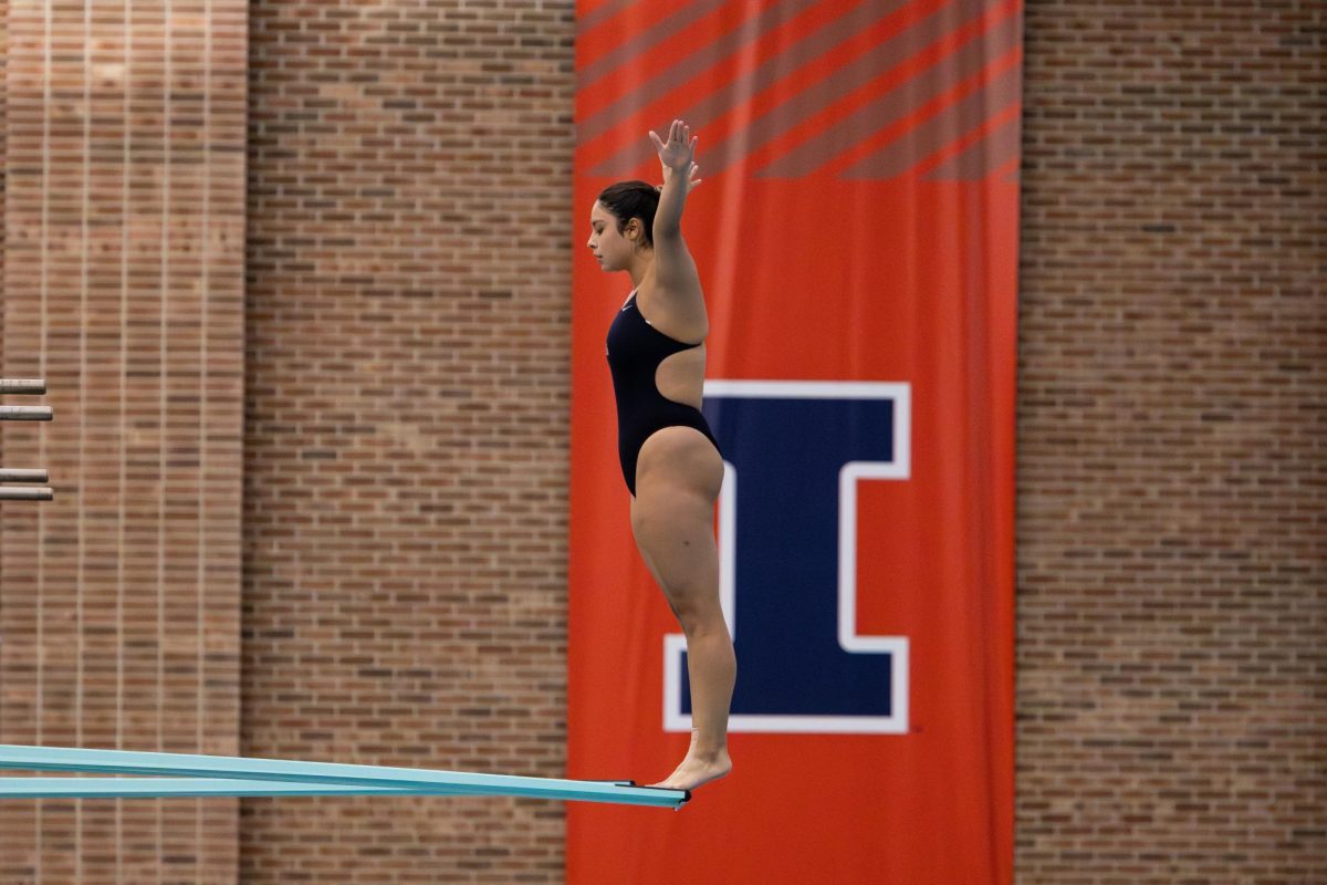 Junior diver Matilda Garcia prepares to dive in the three meter high dive. Garcia ended up placing first in the one and three meter dives in the "House of Paign" meet on Oct. 24 and 25, 2025. 