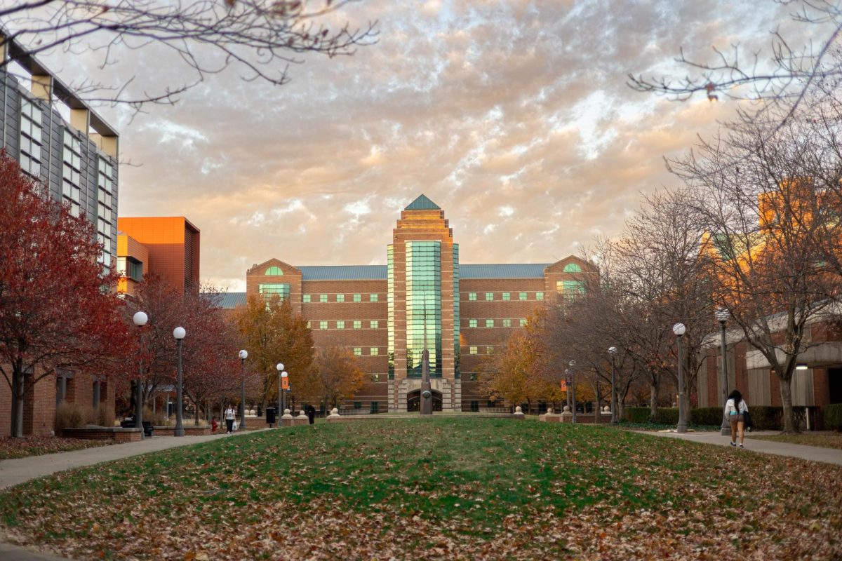 Students walk toward the Beckman Institute on the Main Quad on Nov. 14, 2025. 