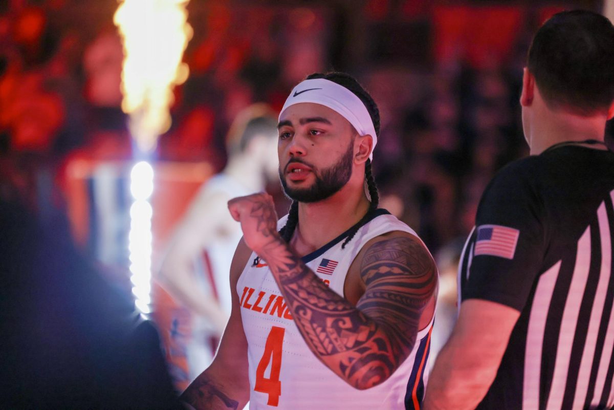 Kylan Boswell goes through starting lineup introductions ahead of Illinois' Jan. 17 game against Minnesota at State Farm Center.