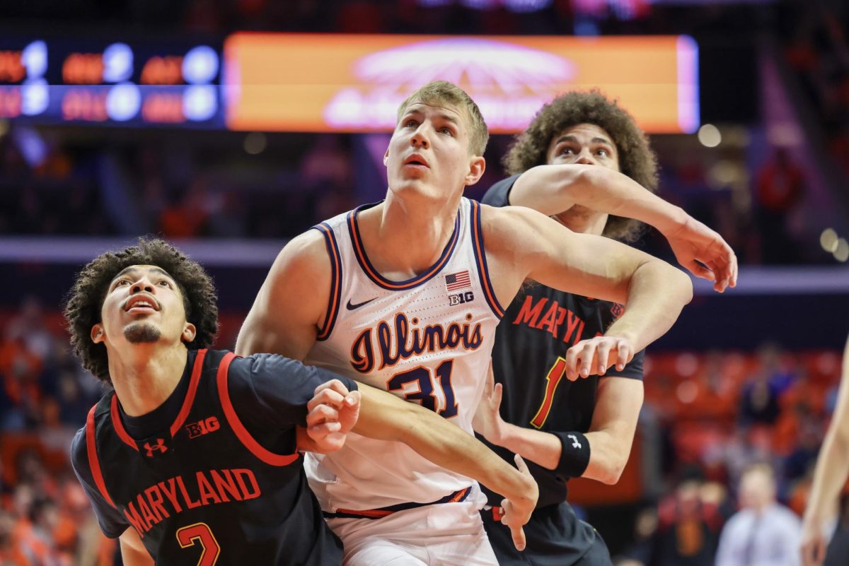 Illinois redshirt freshman forward Jason Jakstys struggles for a rebound against Maryland on Jan. 21 at State Farm Center.